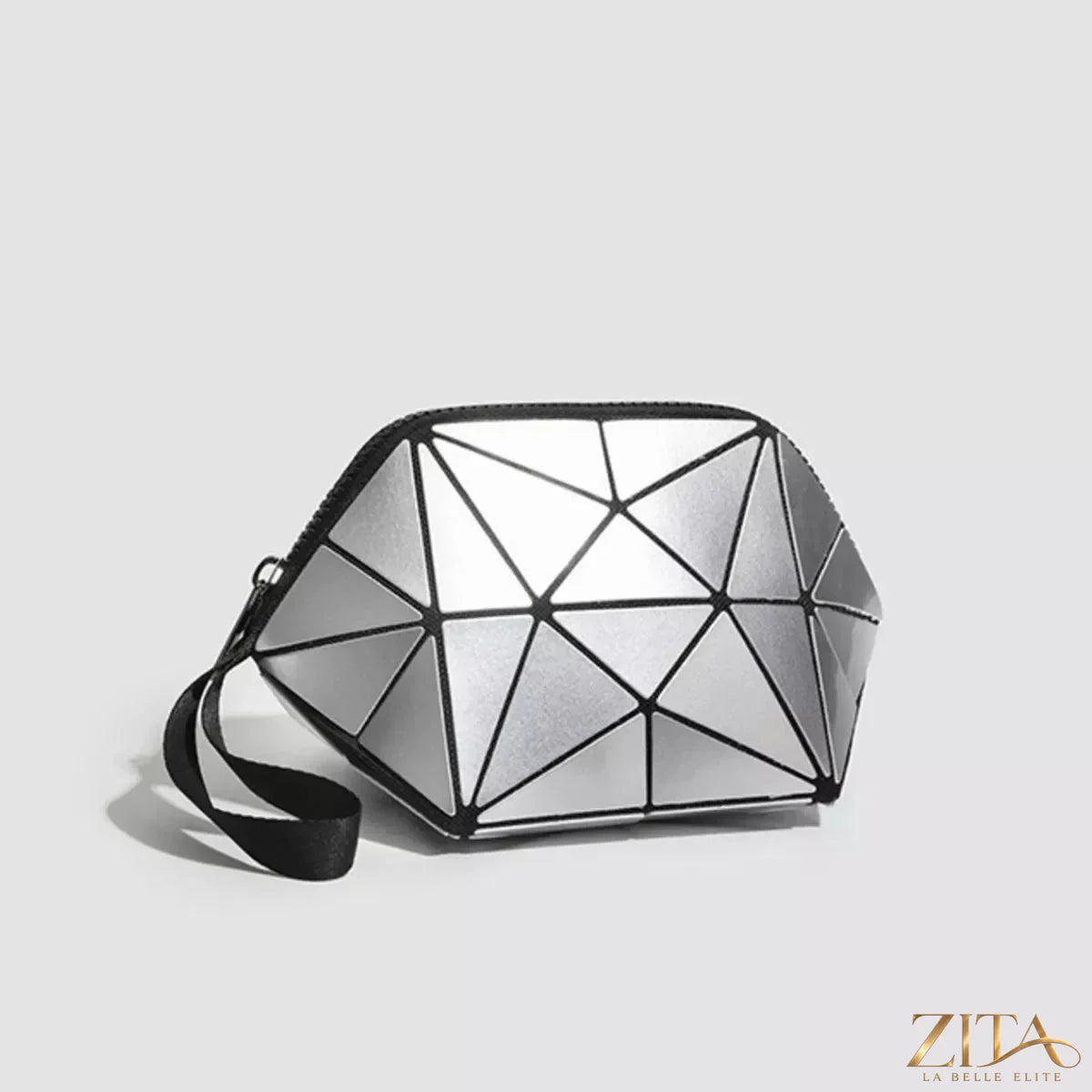 Geometric leather wristlet in neutral tones with a sleek design, featuring a wrist strap and embossed pattern, by Trendsi.