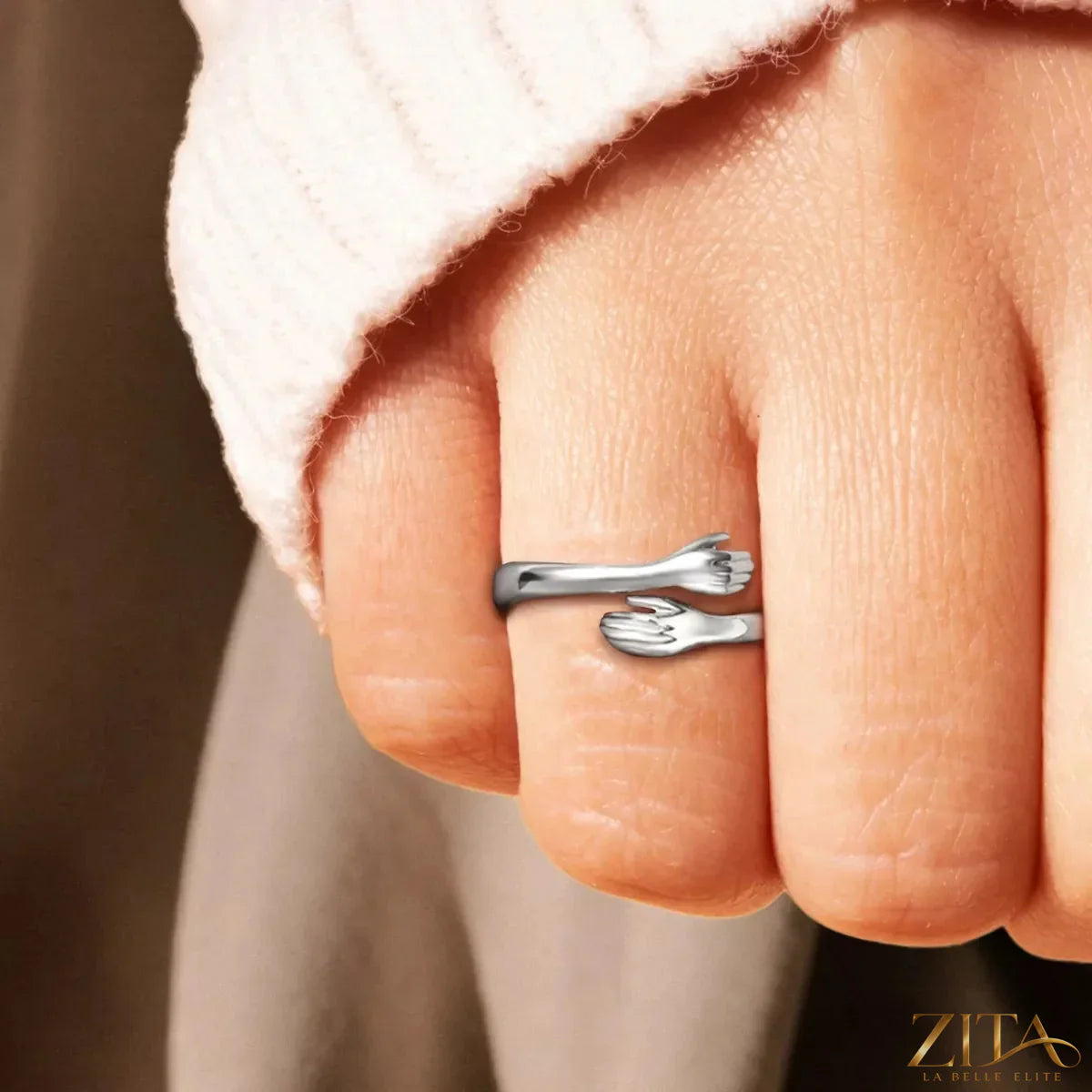 925 Sterling silver hug bypass ring by Zita La Belle Elite, showcasing a sleek, intertwined design on a plain background