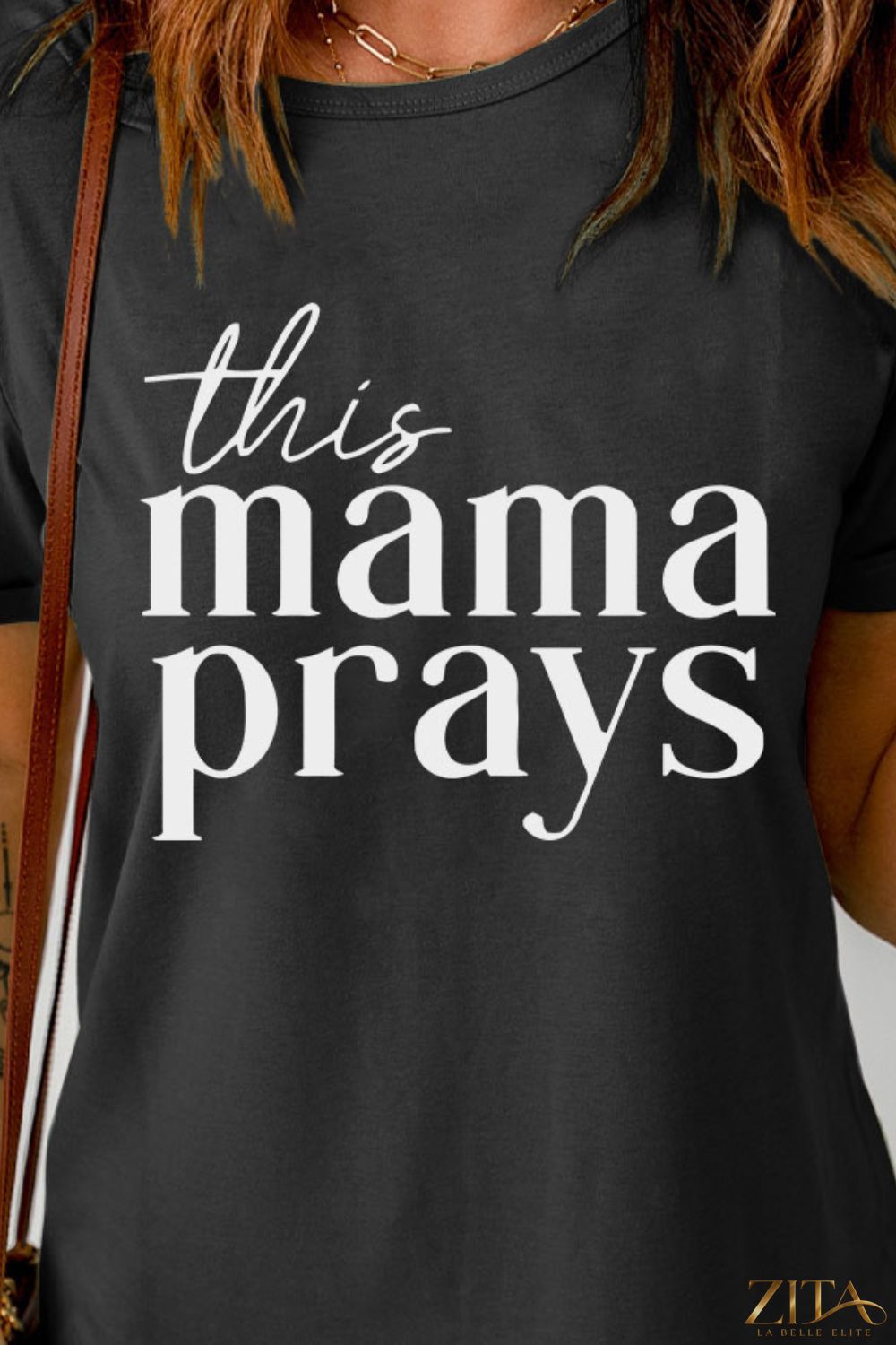 Black "This Mama Prays" graphic T-shirt by Trendsi, featuring bold white text on a casual cotton tee.