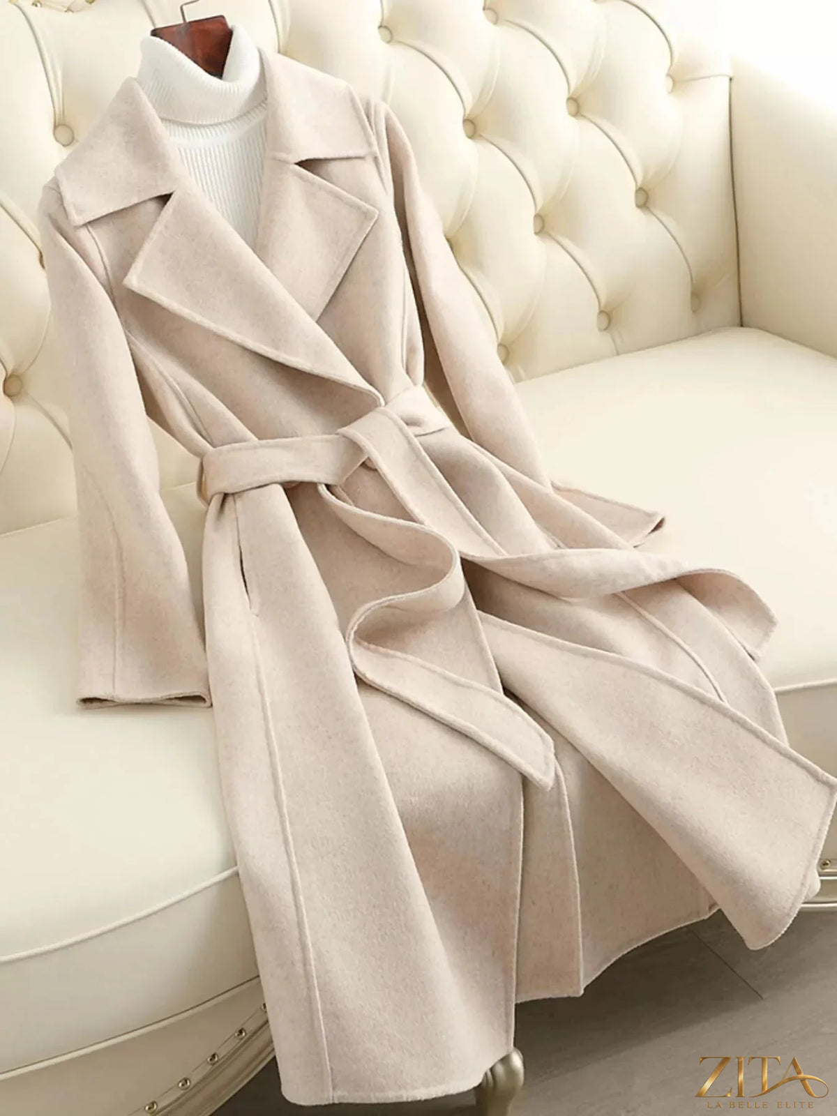 Longline wool coat with waist-defining belt by Zita La Belle Elite, featuring a tailored fit and classic design in neutral tones.