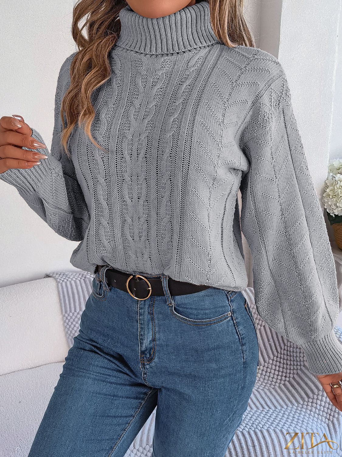 Zita La Belle Elite cable-knit turtleneck sweater in cozy knit fabric, featuring a classic turtleneck design and textured pattern.