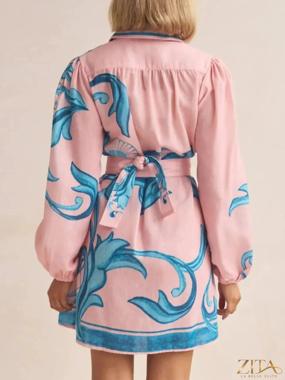 Printed long sleeve shirt dress from Trendsi featuring a stylish design and button-front closure.
