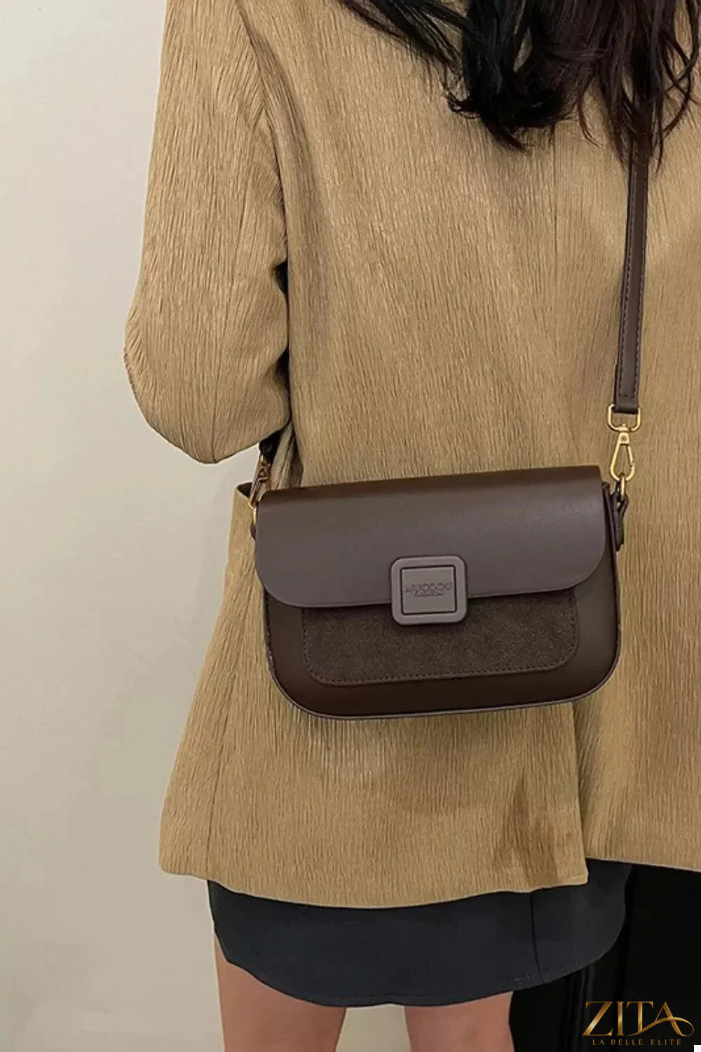 Zita La Belle Elite flap closure shoulder bag in black leather with gold-tone hardware and adjustable shoulder strap.