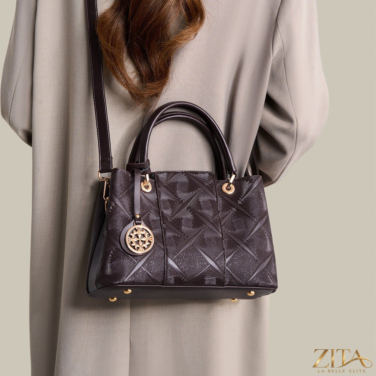 Zita La Belle Elite embossed pattern leather top handle handbag with textured surface and structured design.
