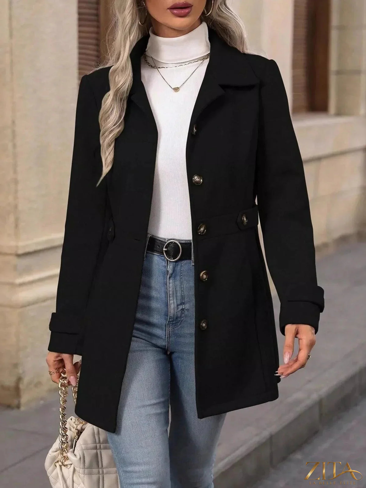 Zita La Belle Elite button-up long sleeve coat hanging on a wooden hanger, showing its tailored design and classic collar.