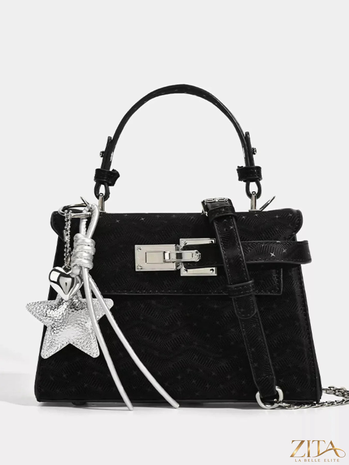 Zita La Belle Elite buckle leather handbag with adjustable strap and gold-tone hardware on smooth black leather surface.