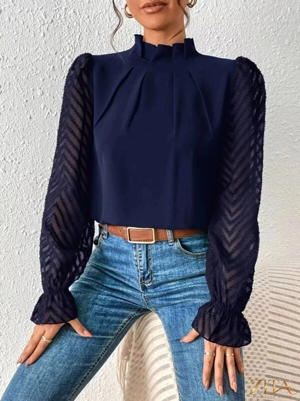 Zita La Belle Elite mock neck blouse with sheer lace sleeves, featuring elegant floral lace details and a fitted silhouette.