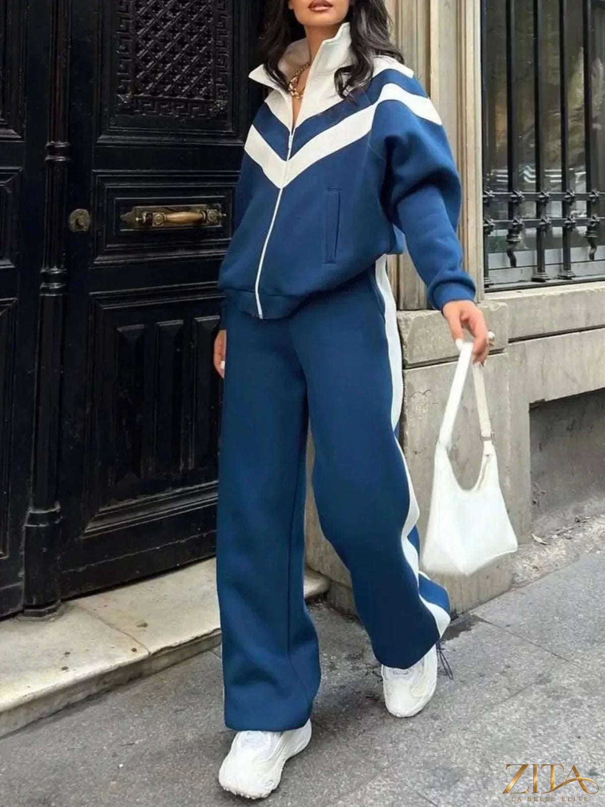 Color block zip-up outerwear and pants set by Zita La Belle Elite, featuring vibrant color blocking and casual fit.