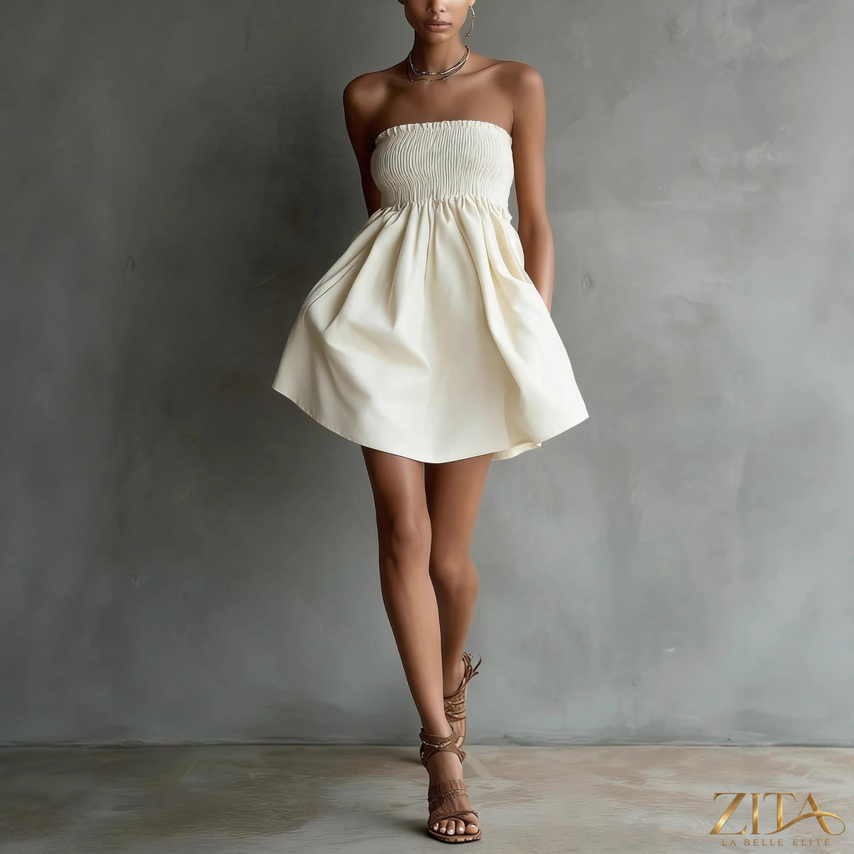 Women's strapless tube mini dress by Zita La Belle Elite in solid color with elastic waist, casualwear style, shown on a model.