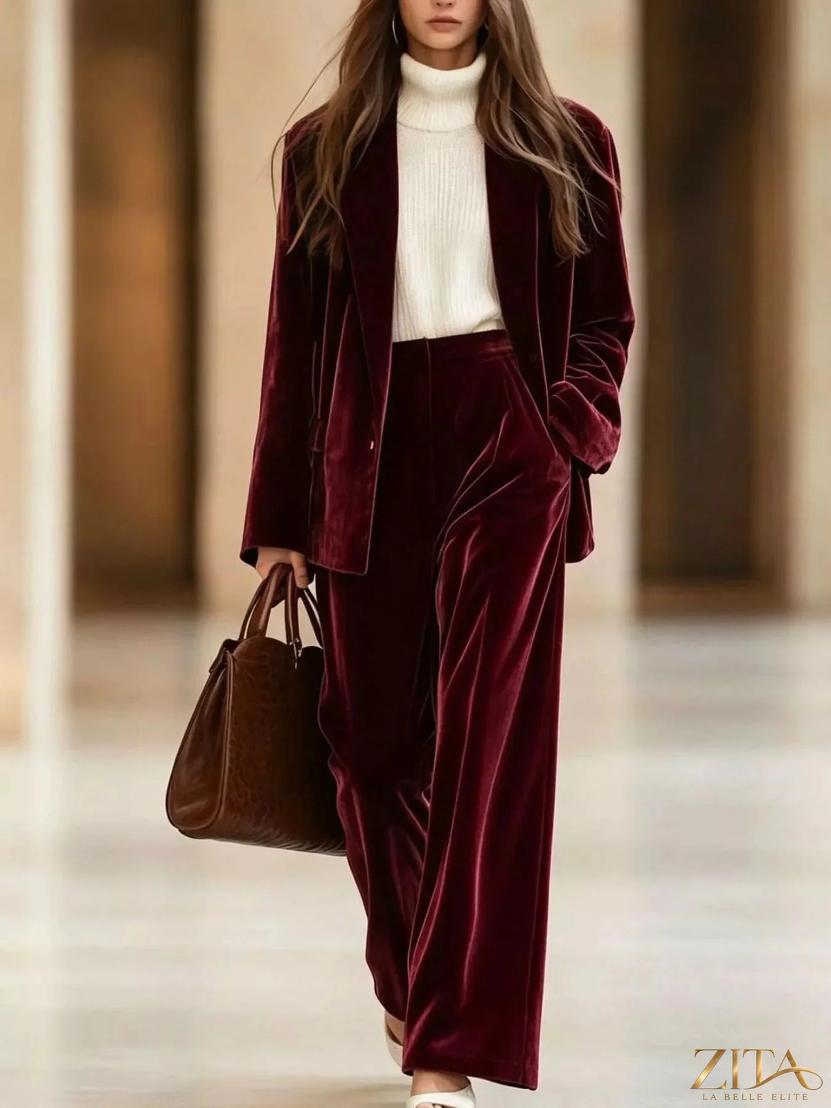 Zita La Belle Elite velvet blazer and wide-leg pants two-piece set displayed on a hanger. Deep green fabric, tailored fit.