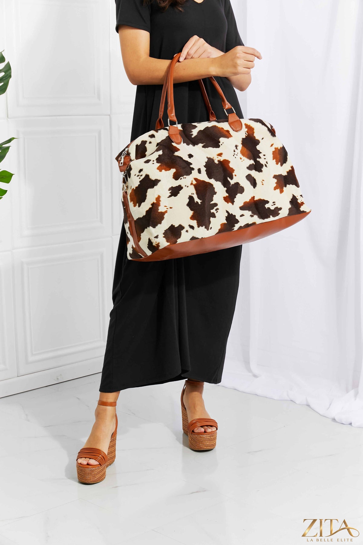 Animal print plush weekender bag by Zita La Belle Elite, featuring a soft textured surface and spacious design for travel.