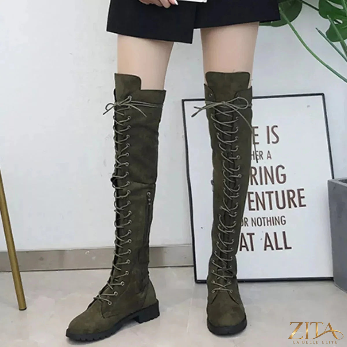 Over-the-knee lace-up boots by Trendsi featuring black faux leather with high block heels and pointed toes.