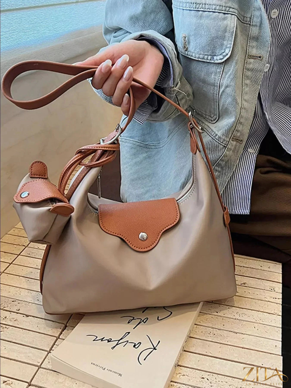 Zita La Belle Elite hobo crossbody bag with coin purse in black leather, showing adjustable strap and textured surface.