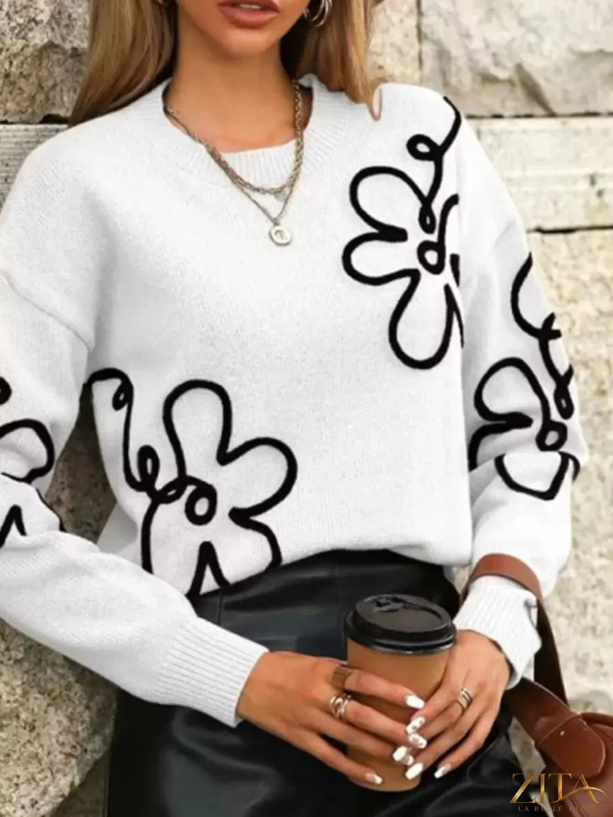 Flower dropped shoulder sweater by Trendsi featuring floral design, cozy knit, and relaxed fit with dropped shoulder sleeves.