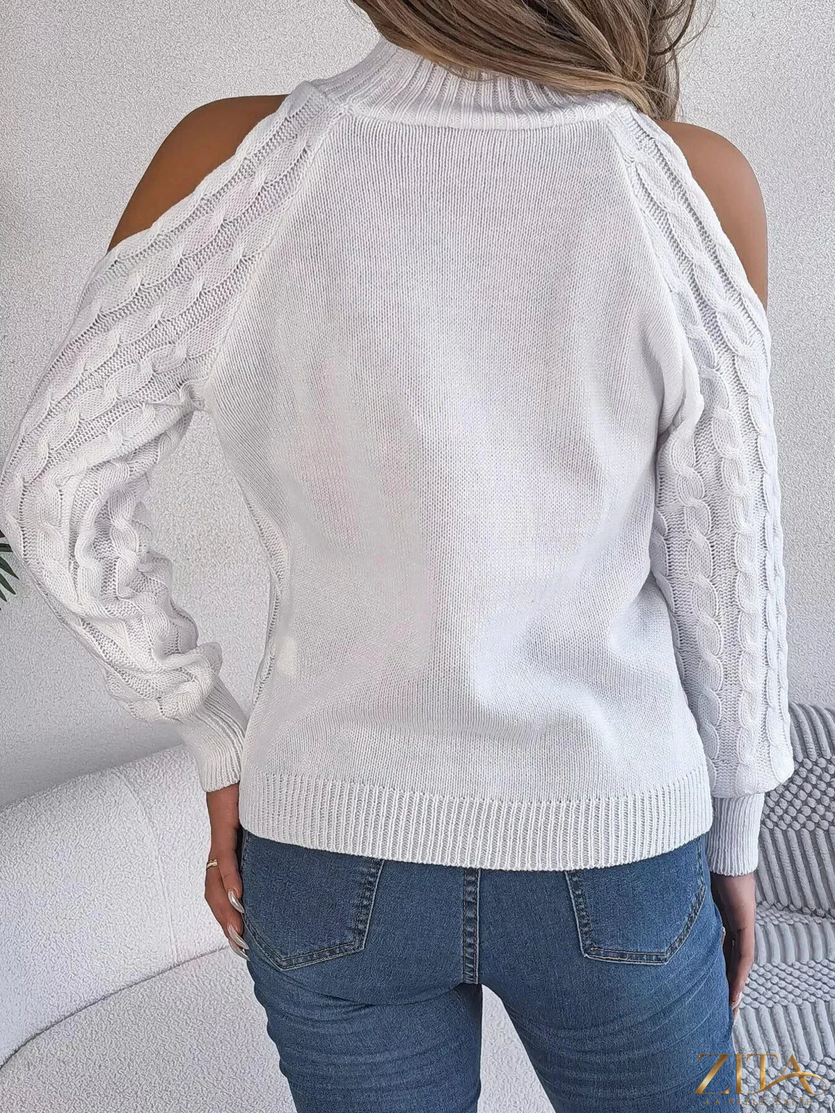 Zita La Belle Elite cold-shoulder cable knit sweater with long sleeves and relaxed fit, featuring open shoulder design and textured knit pattern.