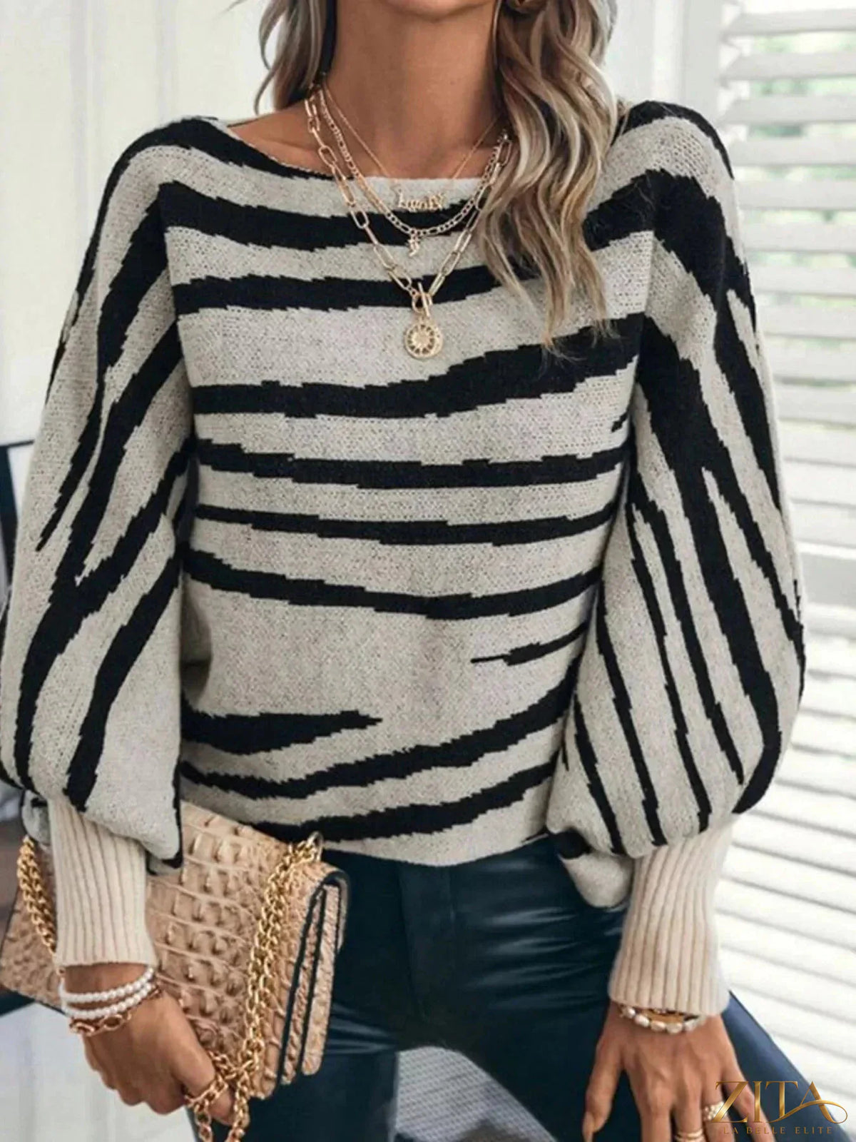 Striped lantern sleeve sweater by Trendsi featuring bold horizontal stripes and lantern-style balloon sleeves.