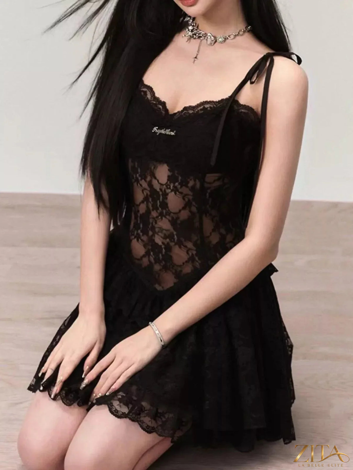 Zita La Belle Elite lace tie shoulder mini dress featuring delicate lace fabric and a fitted silhouette on a model.