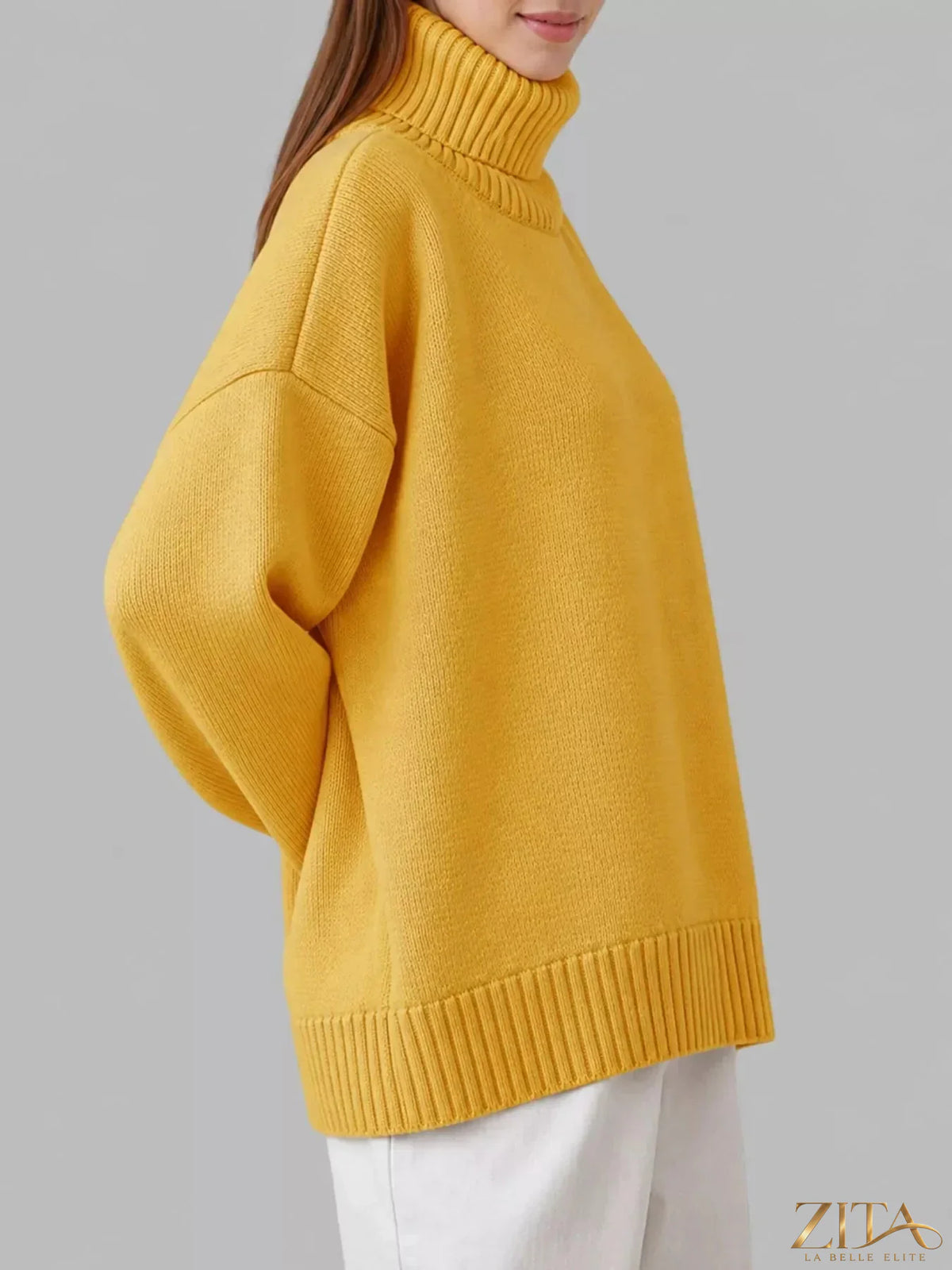 Zita La Belle Elite turtleneck dropped shoulder sweater in soft knit fabric, showcasing a cozy, relaxed fit with a high neckline.