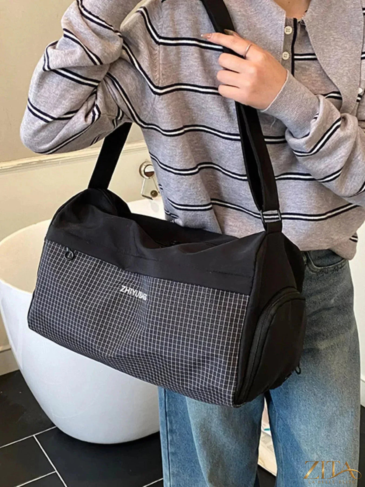Zita La Belle Elite plaid Oxford cloth travel bag with leather handles and zipper closure, styled for travel or weekend trips.