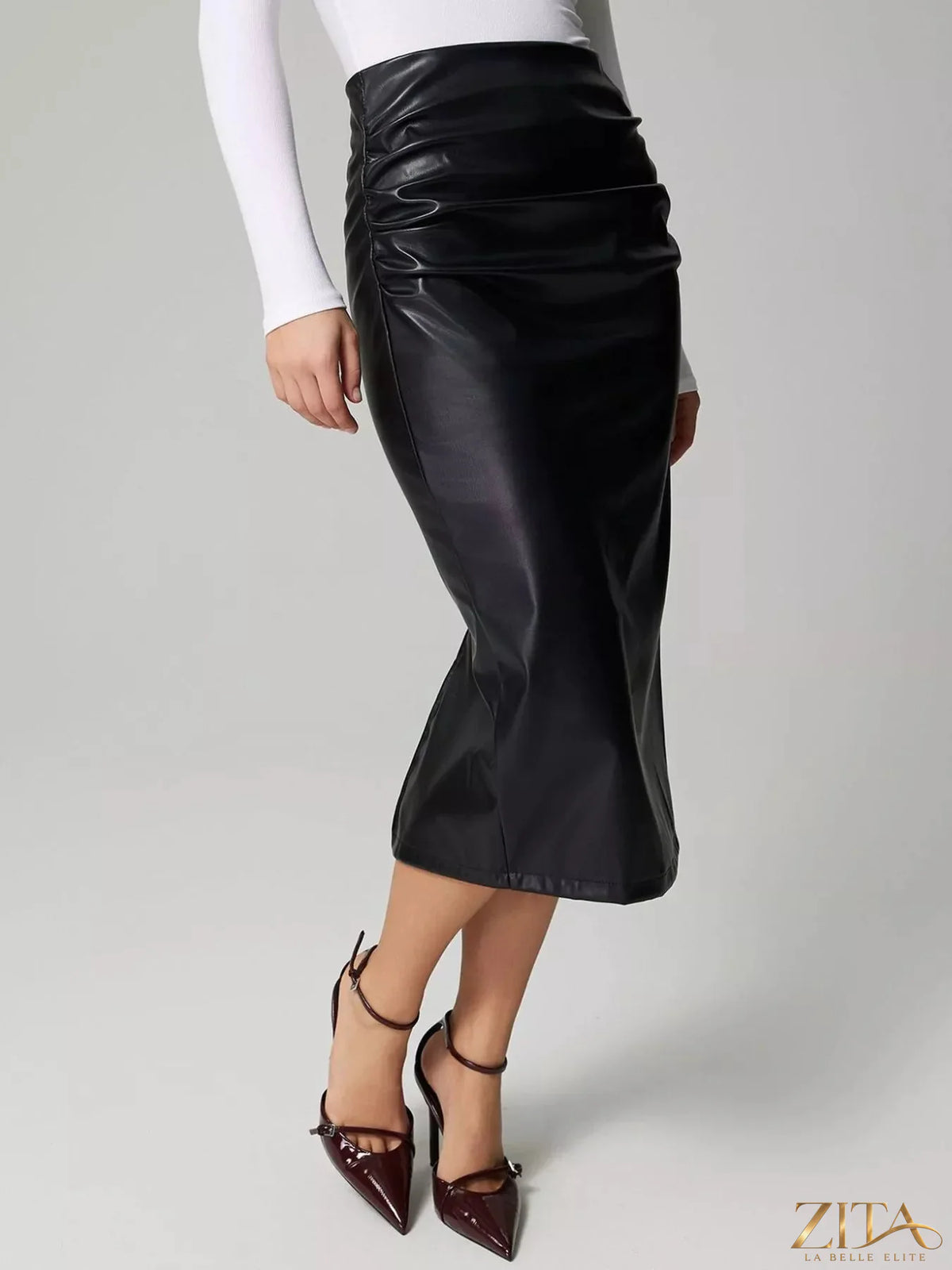 Zita La Belle Elite leather skirt with a stylish slit back, showcasing smooth black leather and a modern, fitted design.