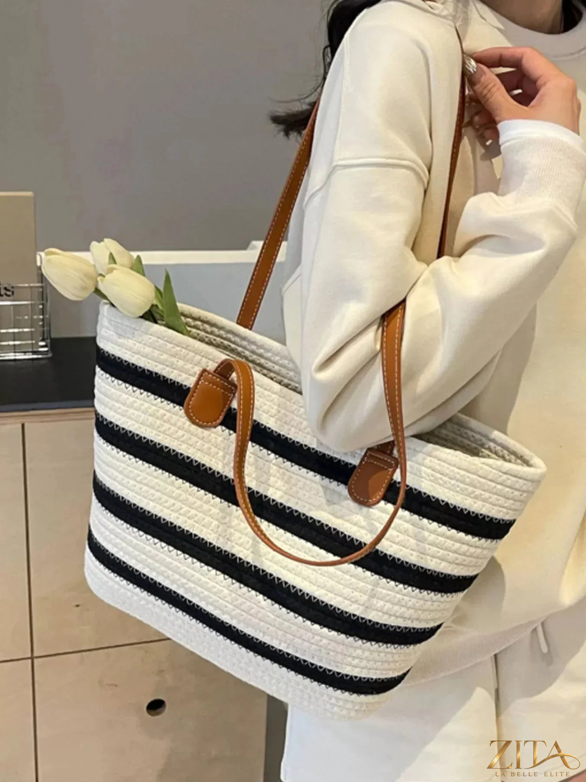 Zita La Belle Elite striped straw tote bag with blue and white pattern, featuring sturdy handles and spacious interior for daily use.