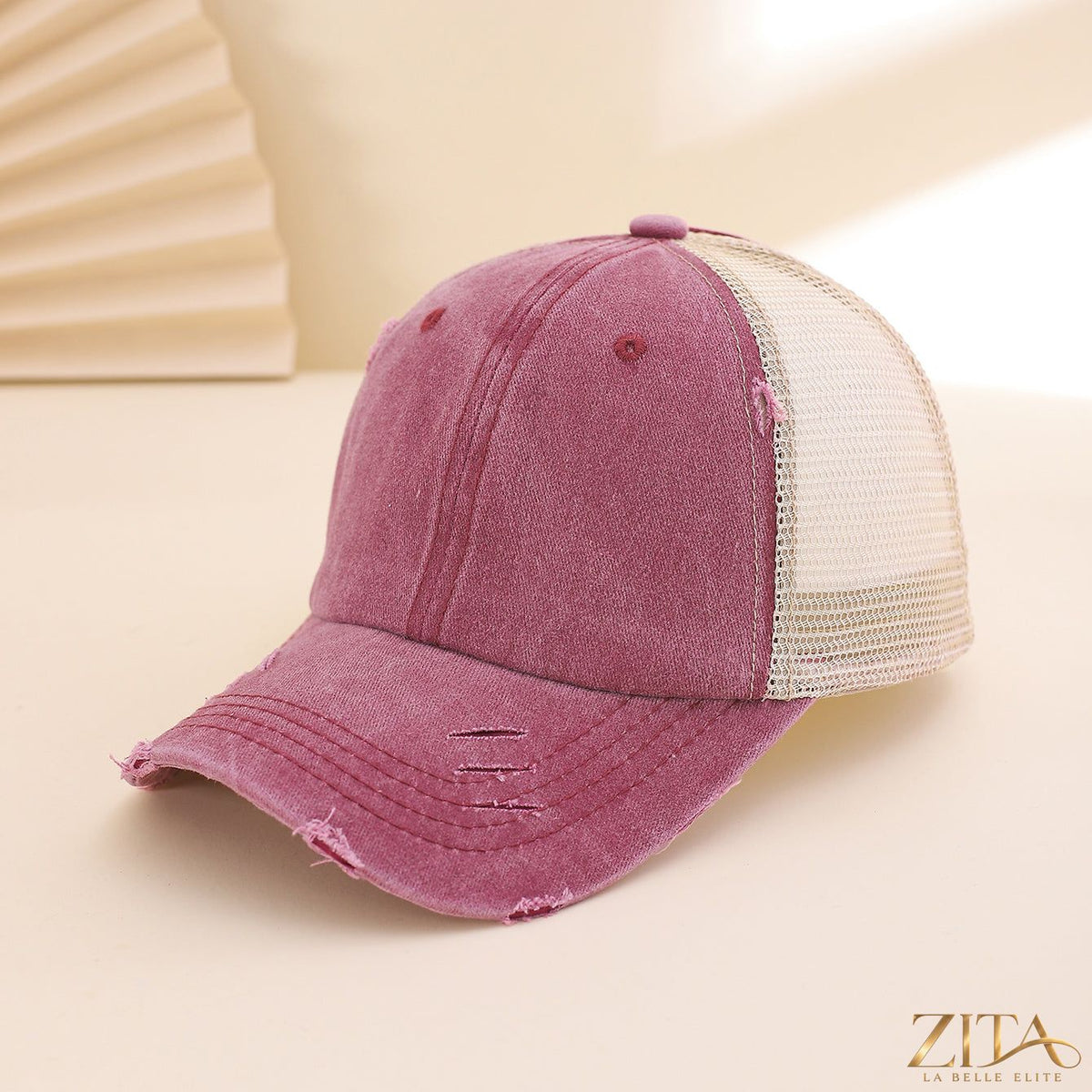 Distressed washed mesh baseball cap by Zita La Belle Elite featuring a casual, worn-in style with breathable mesh fabric.