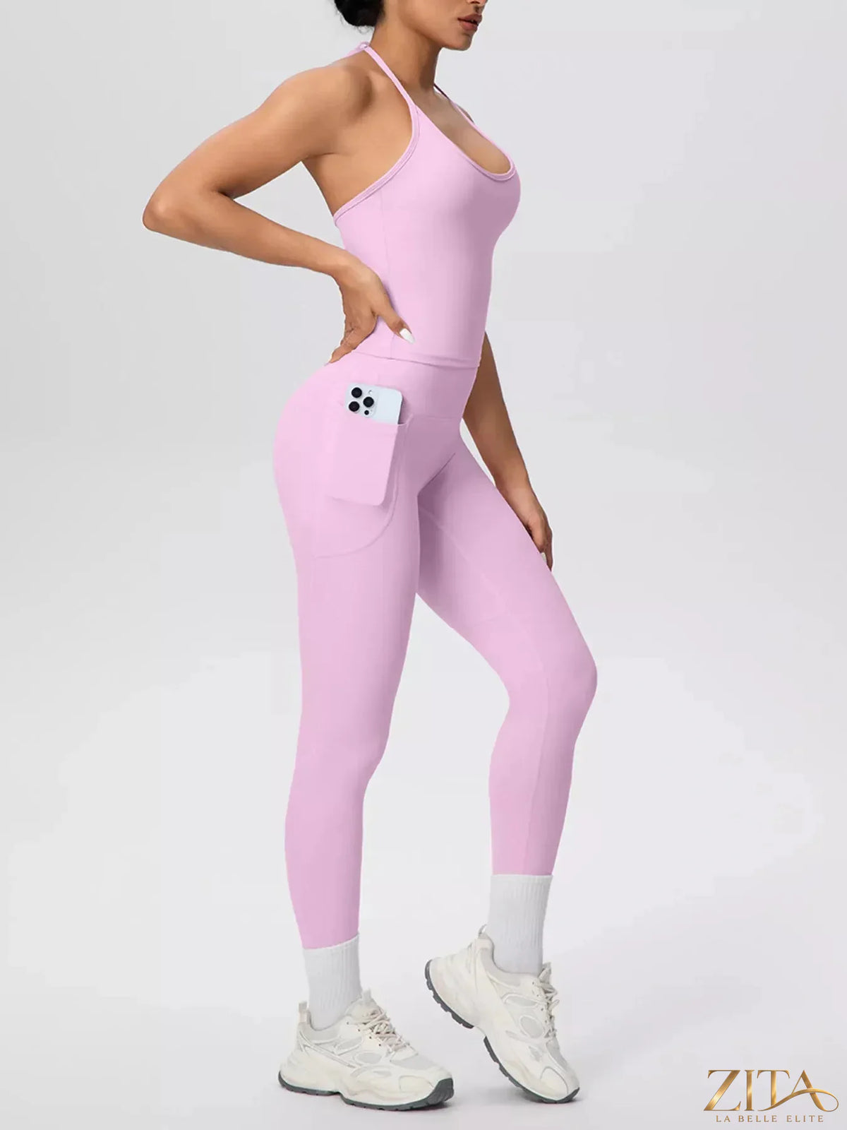 Zita La Belle Elite halter neck cami top and high-waisted leggings active set in black, worn by a model outdoors.
