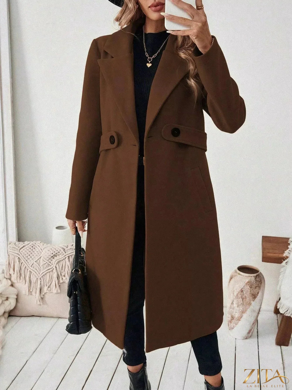 Zita La Belle Elite single-button longline coat in neutral fabric, displayed hanging with a tailored collar and sleek silhouette.