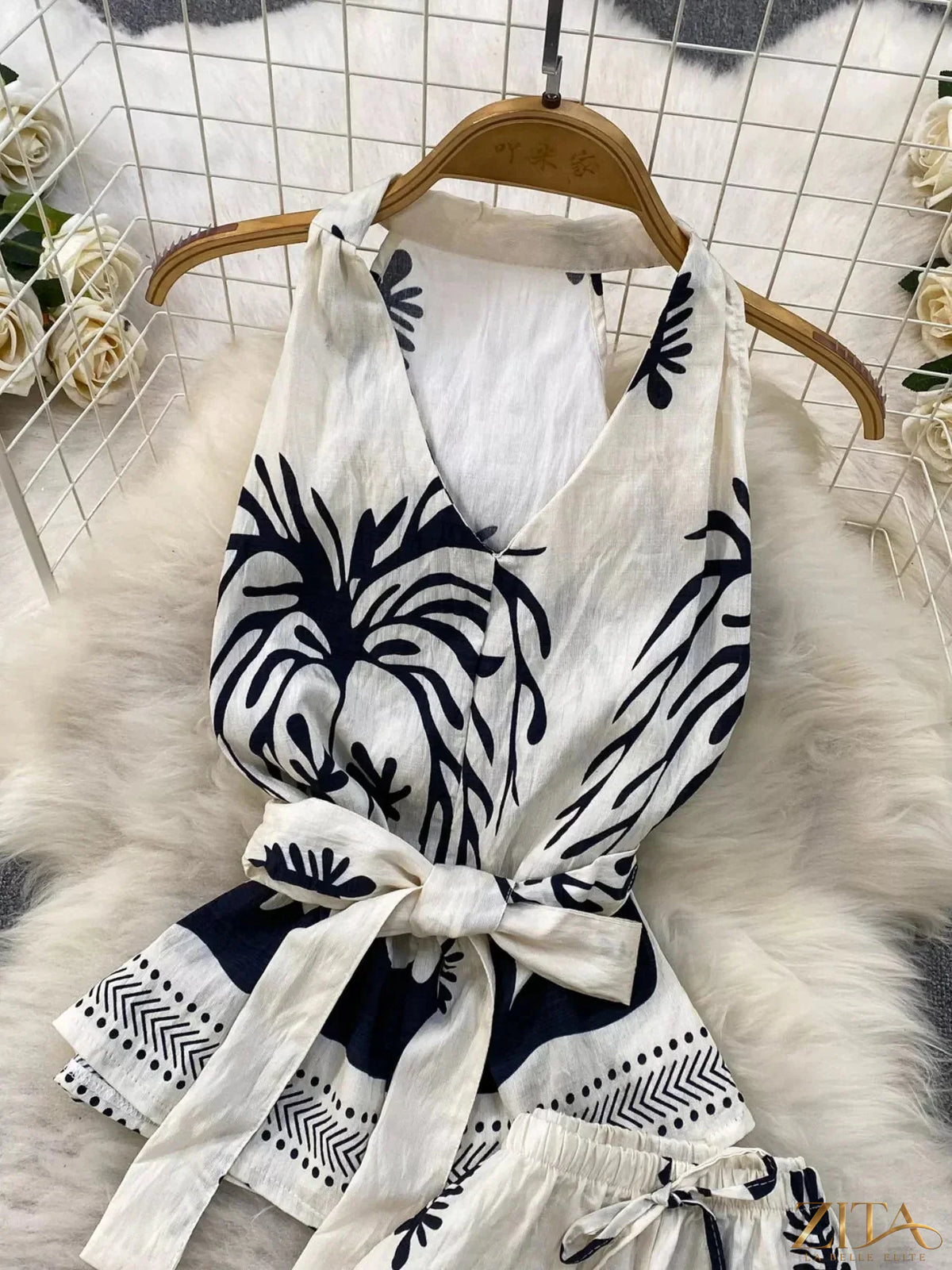 Printed sleeveless top and wide-leg pants set by Zita La Belle Elite, featuring a stylish, coordinated fashion ensemble.