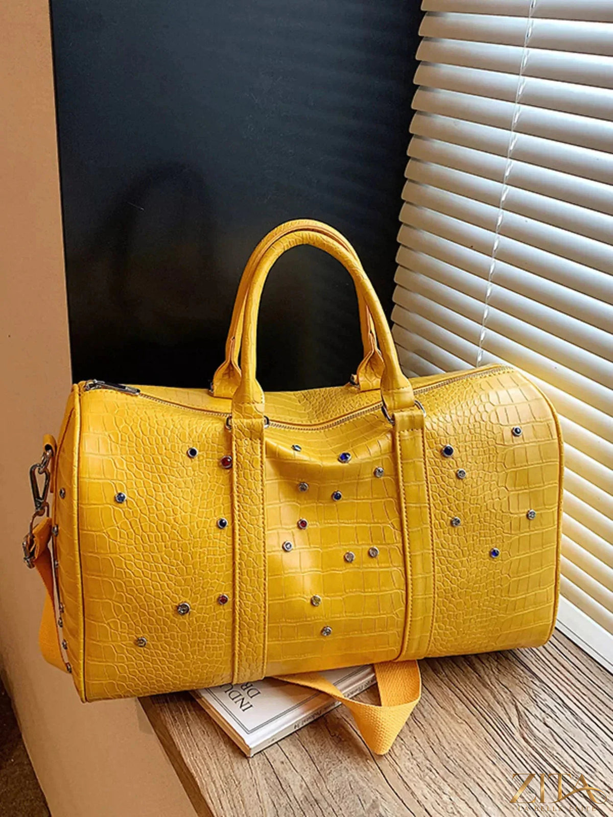Crocodile embossed Zita La Belle Elite travel bag with studded accents, featuring a sleek rectangular shape and sturdy handles.