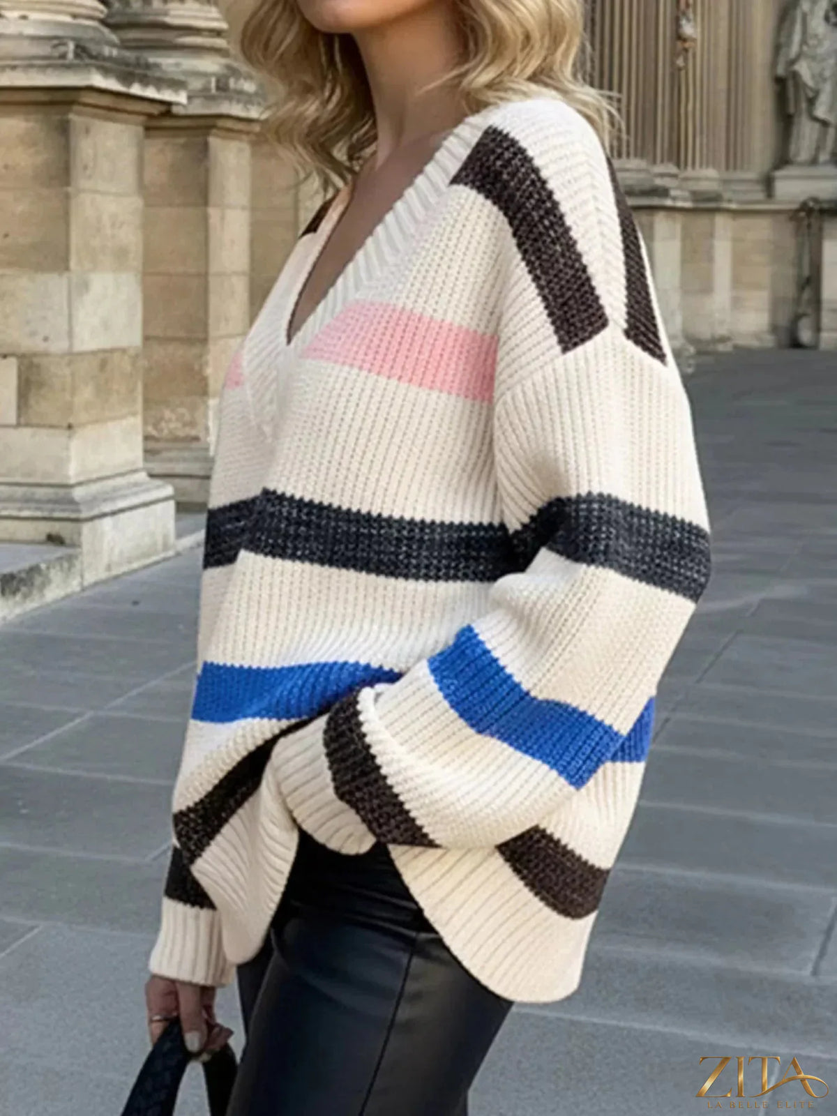 Striped V-neck oversized sweater by Trendsi, featuring bold horizontal stripes and a relaxed fit, perfect for casual wear.