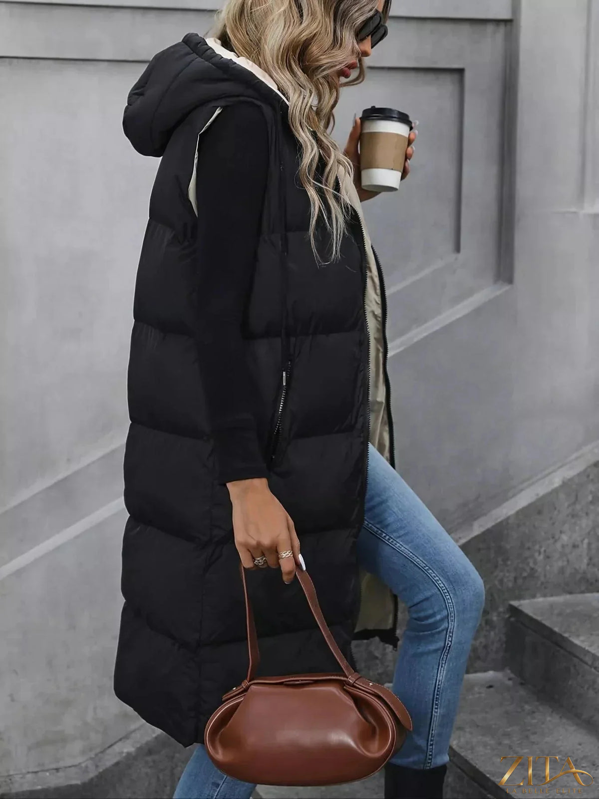 Zita La Belle Elite longline padded hooded vest coat with a sleek silhouette and quilted design for warmth and style.