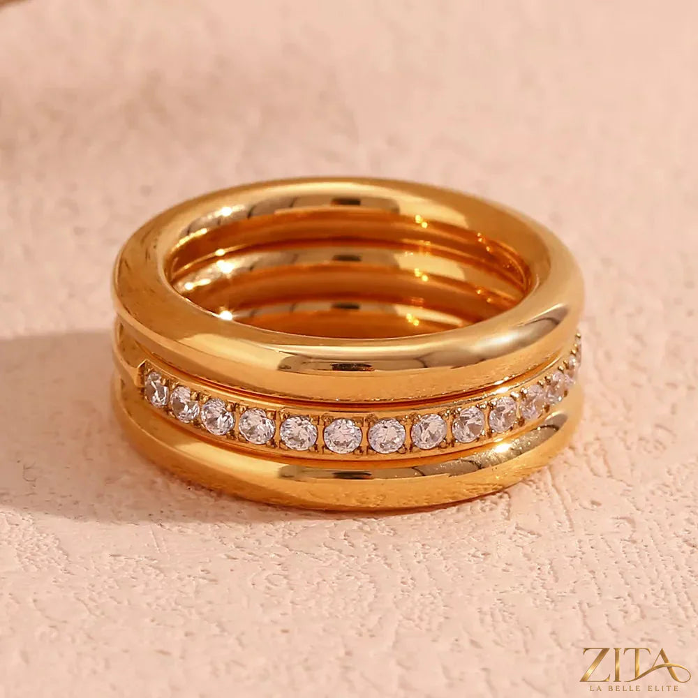 Set of three stainless steel zircon rings from Zita La Belle Elite, showcasing shiny, elegant jewelry with sparkling zircon stones.