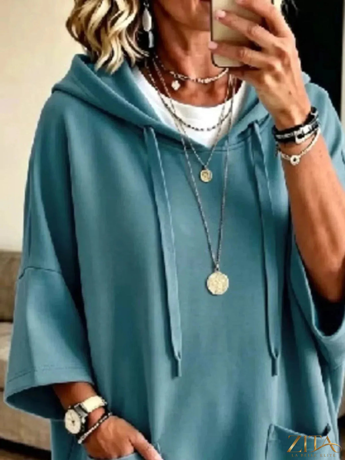 Plus size oversized drawstring hoodie with front pockets by Zita La Belle Elite, shown in a relaxed fit with a hood and casual style.