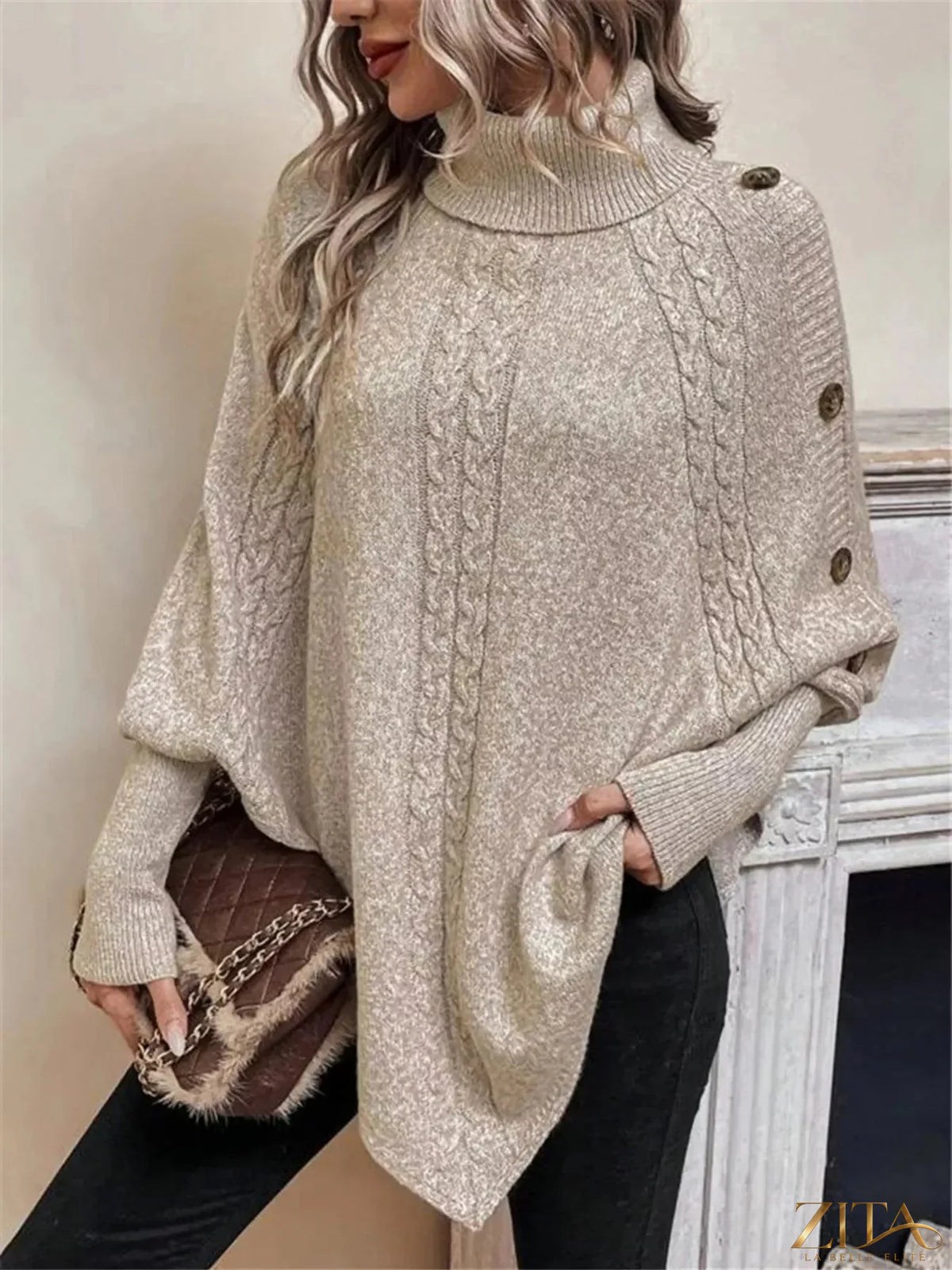Cable knit turtleneck cape sweater by Trendsi, featuring a cozy oversized design with ribbed detailing and a stylish fall look.