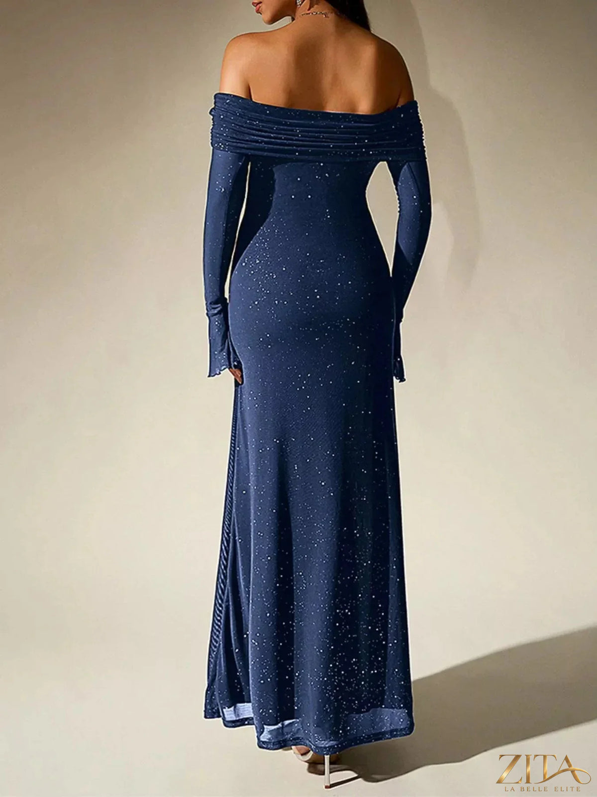 Zita La Belle Elite glitter off-shoulder maxi dress with a flowing silhouette and sparkling fabric, perfect for elegant evening wear.