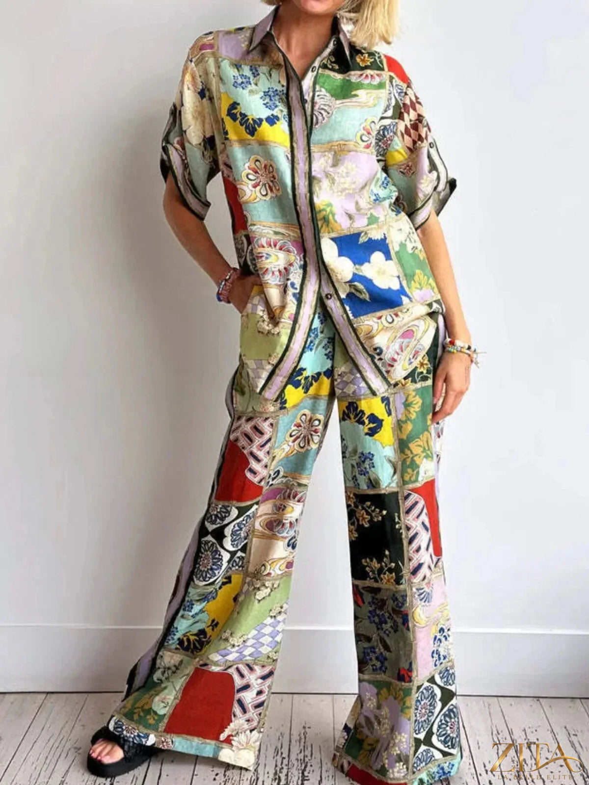 Printed button-up shirt and pants set by Zita La Belle Elite, stylish and coordinated casual outfit, shown on a hanger.