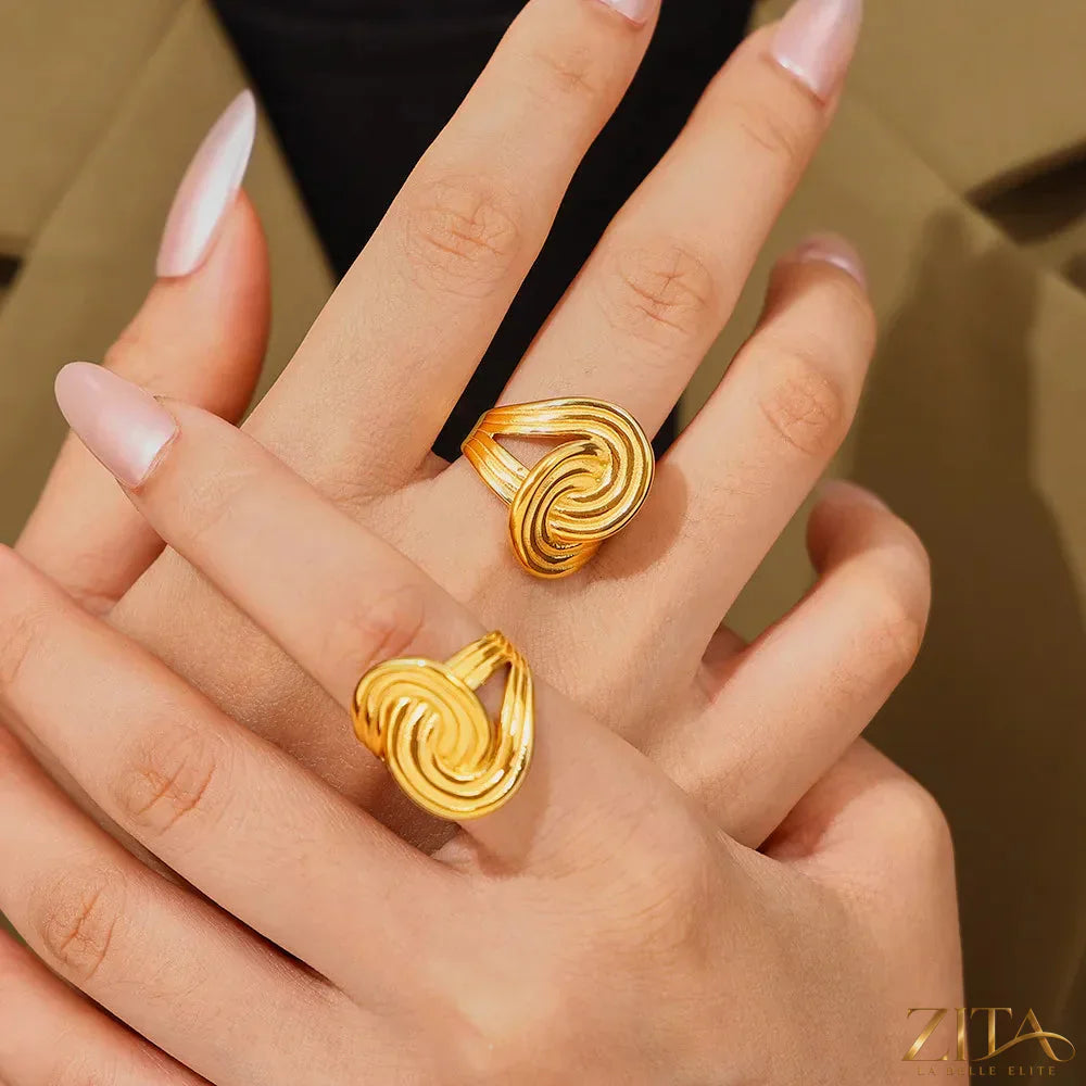 18K gold-plated twisted ring by Zita La Belle Elite, showcasing a sleek, elegant design with a smooth, polished finish.