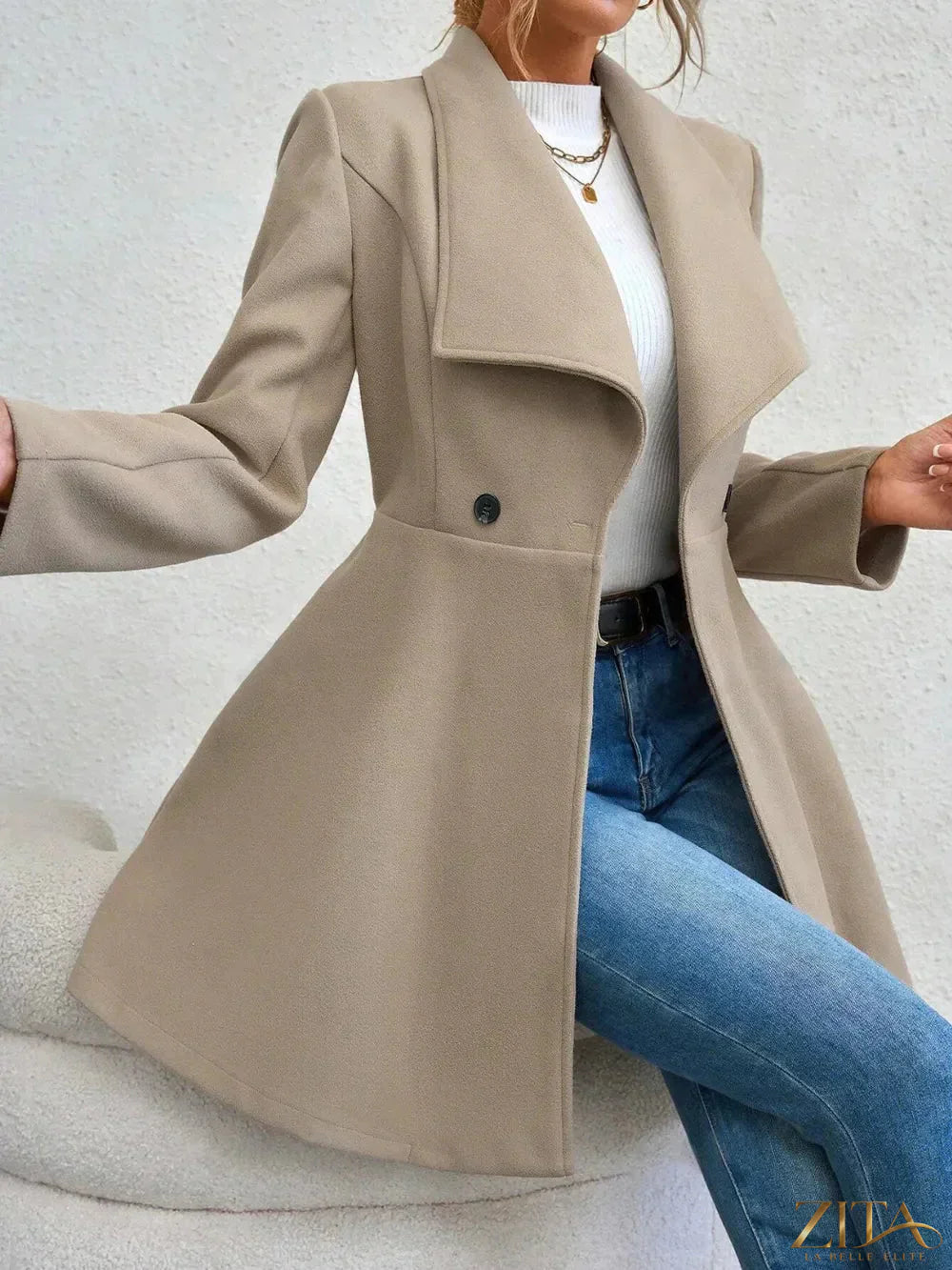 Zita La Belle Elite collared neck button-up long sleeve coat displayed on a hanger, showcasing its stylish design and classic silhouette.