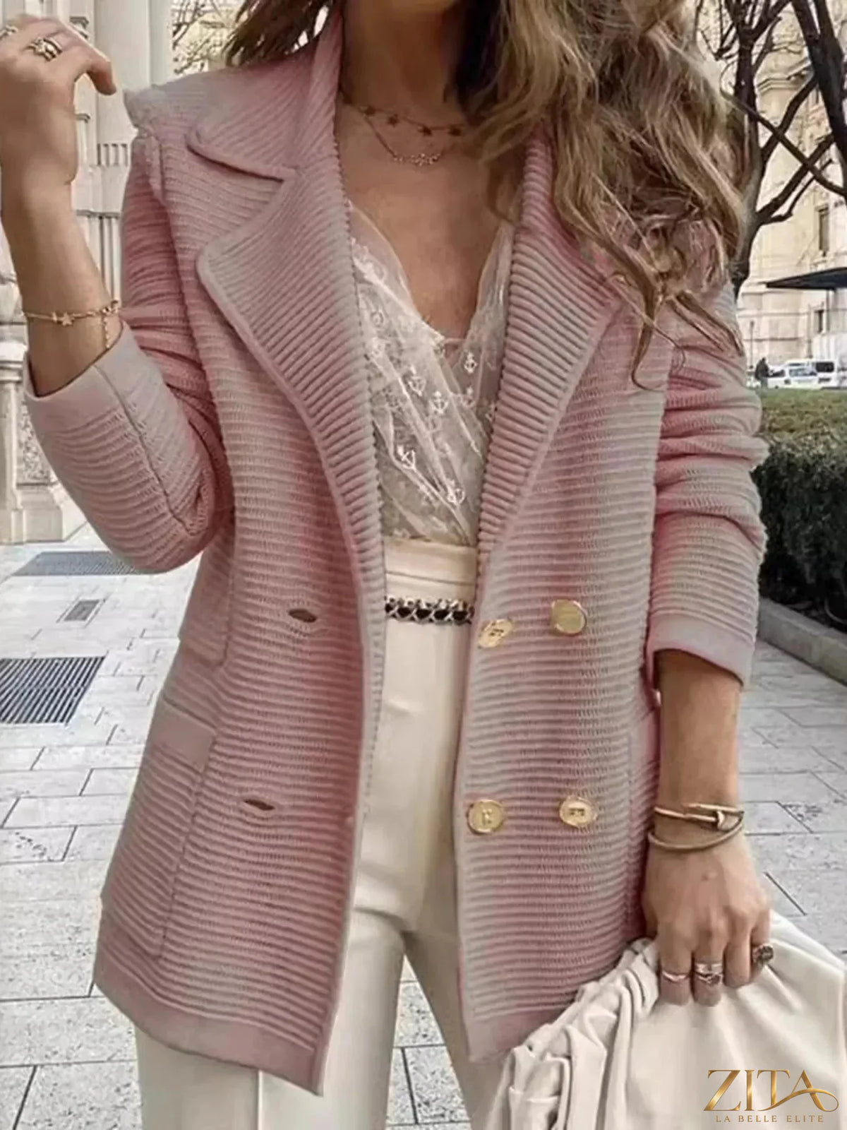 Zita La Belle Elite texture knit double-breasted blazer with notch lapels and long sleeves, shown on a hanger.