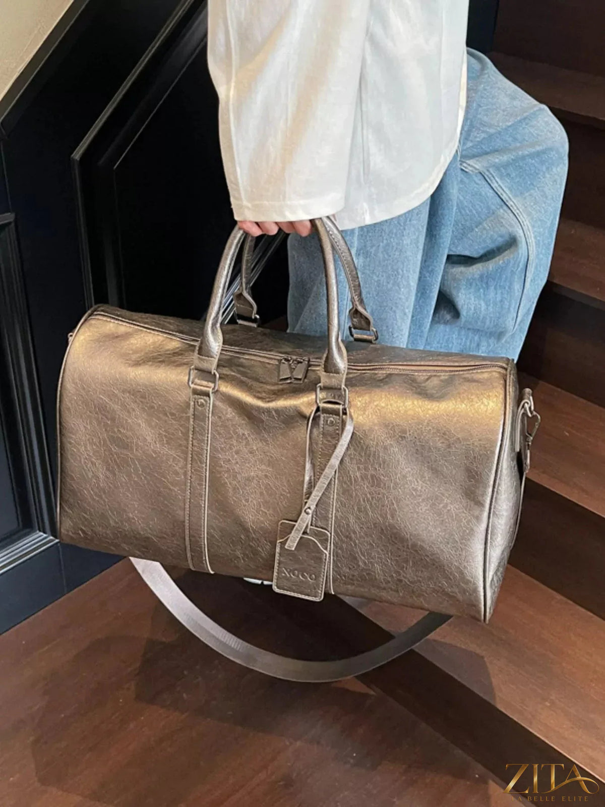 Trendsi PU leather duffle bag with sturdy handles and spacious main compartment, ideal for travel and gym use.