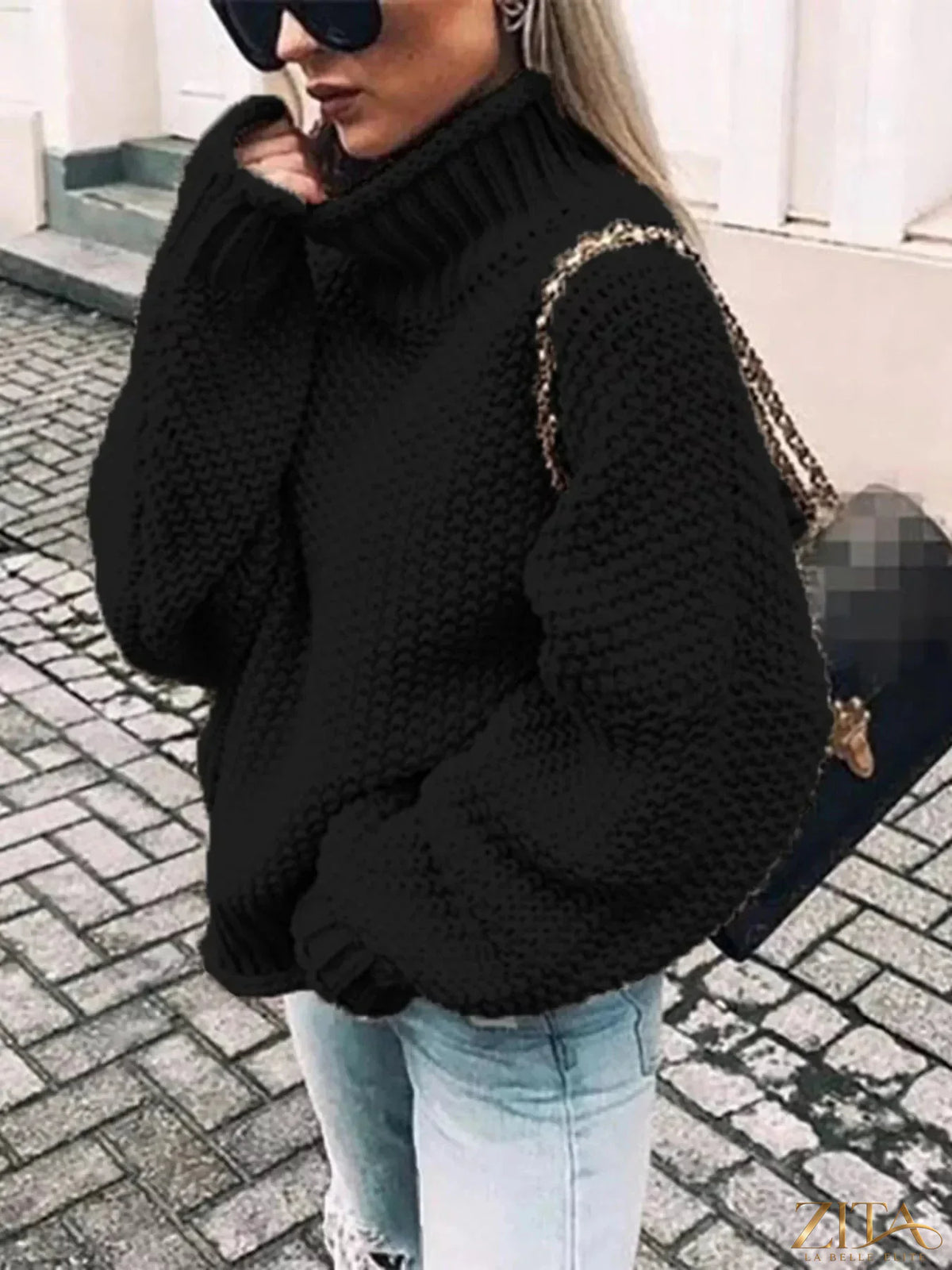 Zita La Belle Elite chunky knit turtleneck sweater in cozy beige with thick ribbed collar and textured knit pattern.