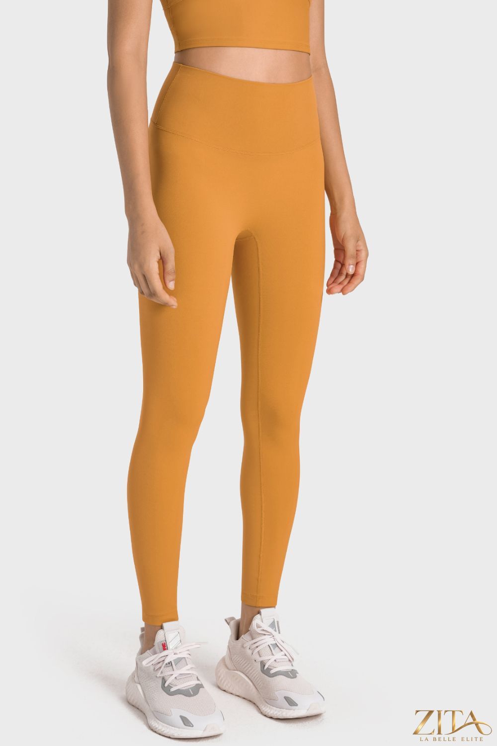 Millennia high-rise wide waistband yoga leggings by Trendsi, shown in black with a comfortable stretch fit and wide waistband.