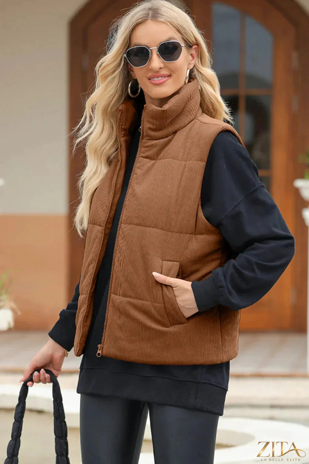 Trendsi pocketed zip-up turtleneck vest coat featuring a high collar and front pockets, styled in soft, warm fabric.