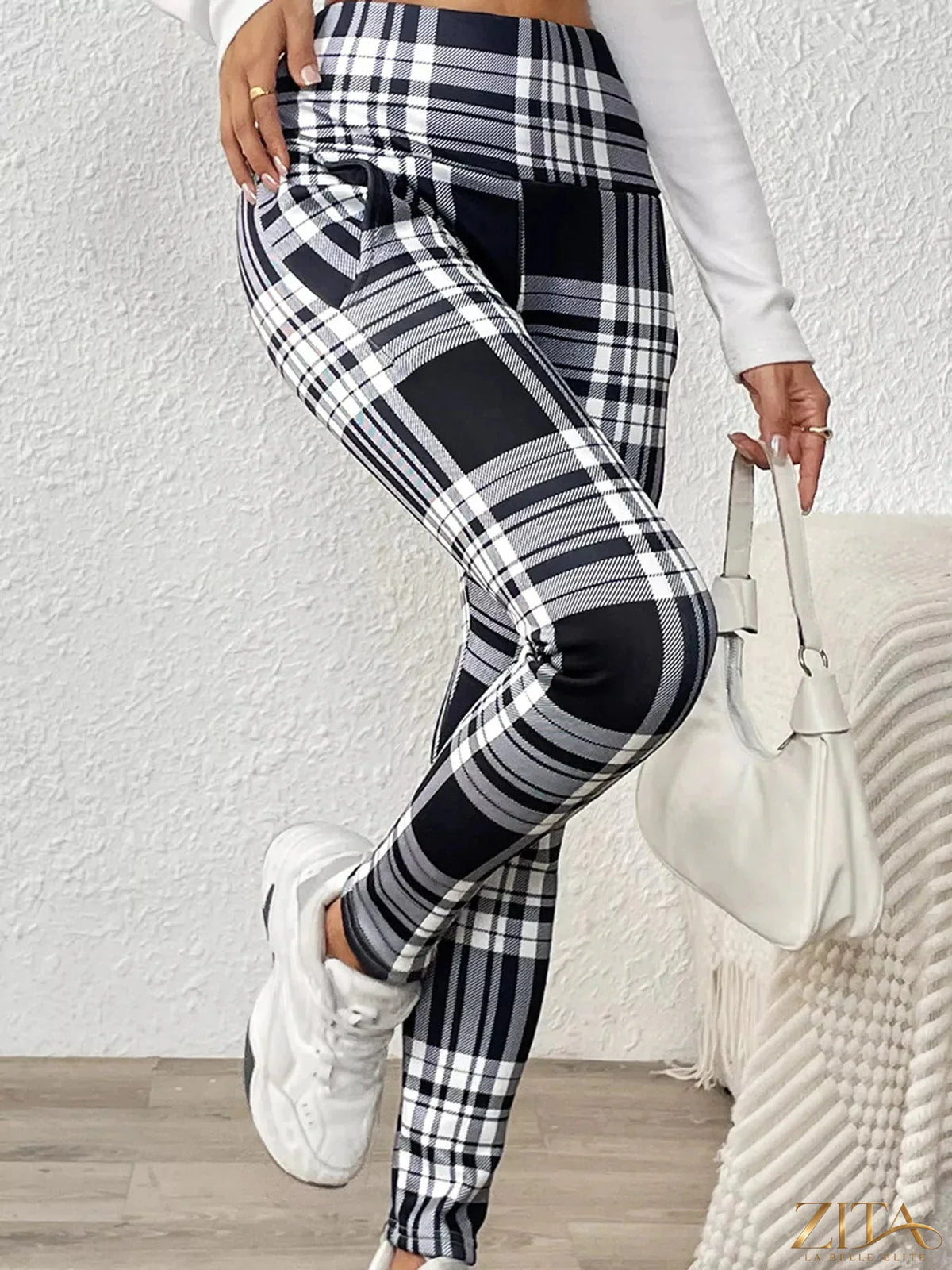 High-waisted plaid slim-fit leggings by Trendsi featuring a stylish checkered pattern and comfortable stretch fabric.