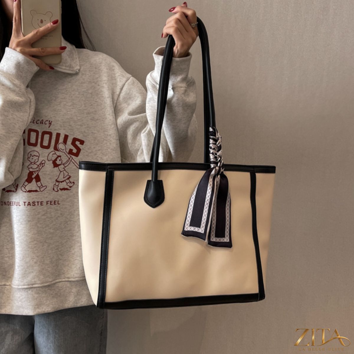 Zita La Belle Elite contrast tote bag with black and white design, showing sturdy handles and spacious interior.