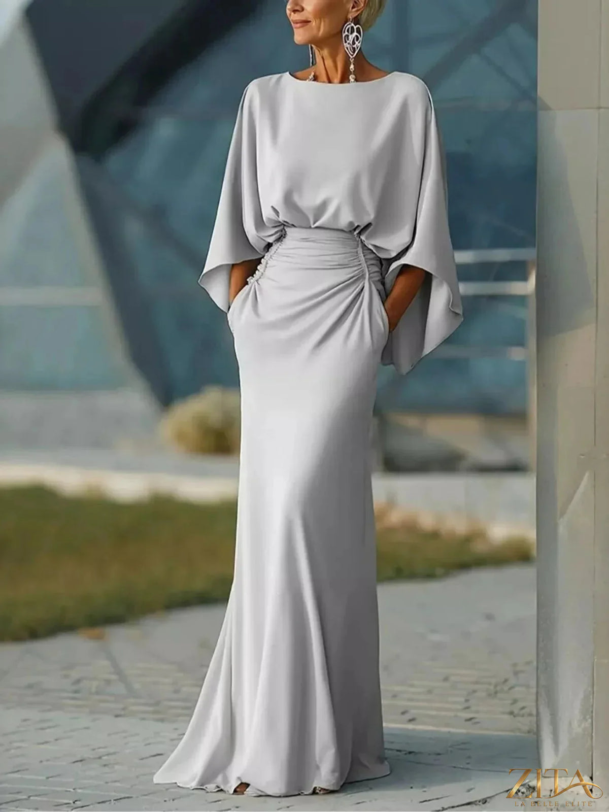 Zita La Belle Elite batwing sleeve ruched maxi dress in flowing fabric, featuring a fitted waist and elegant design.