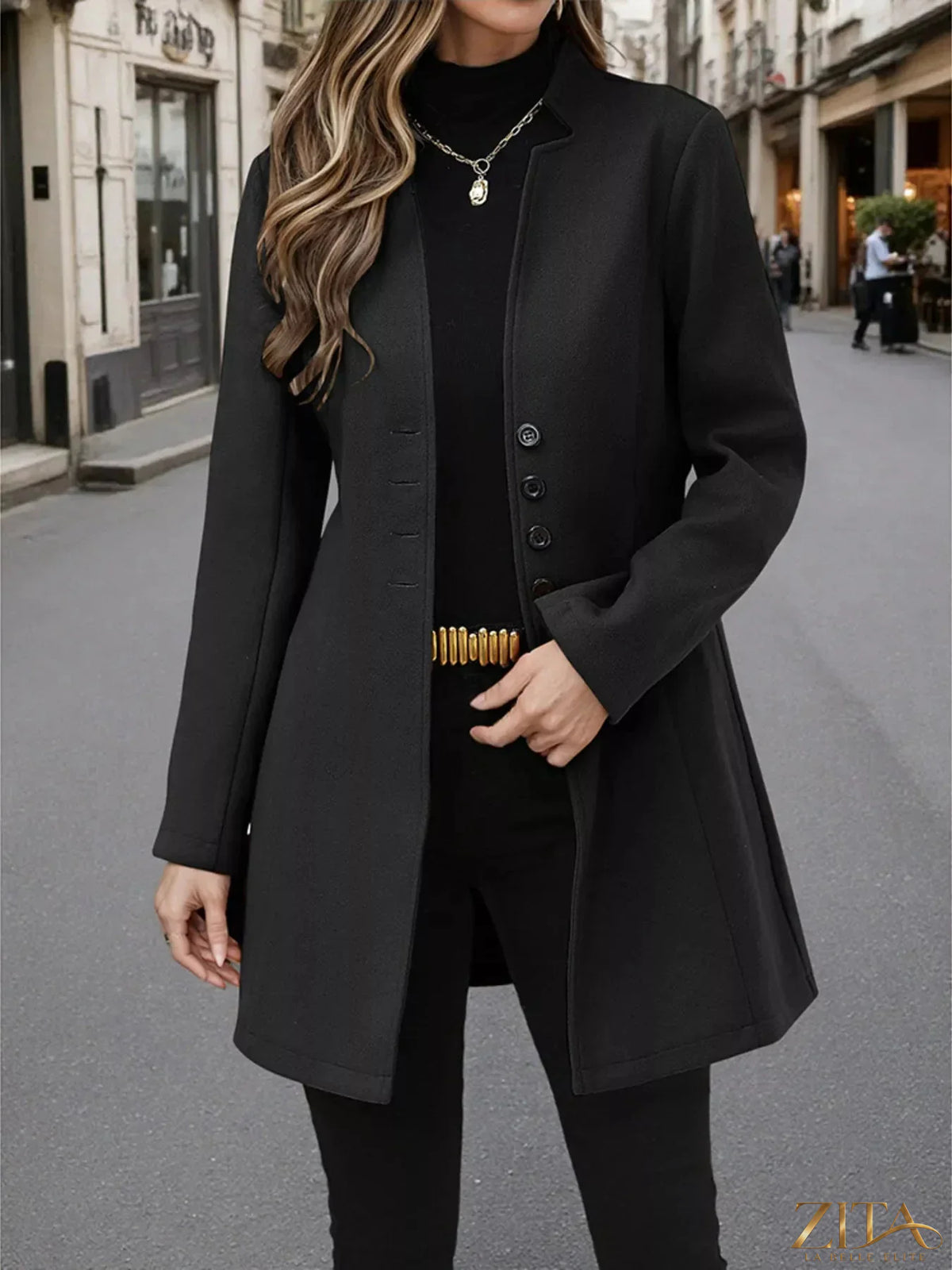 Zita La Belle Elite button-up long sleeve coat hanging on a wooden rack, featuring a classic collar and tailored fit.