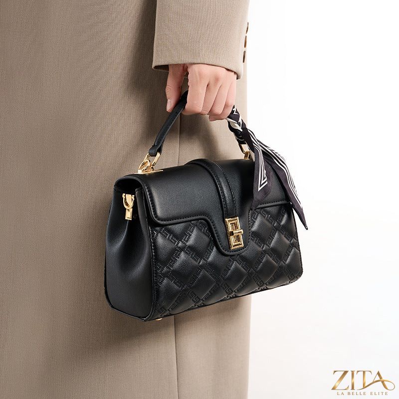 Trendsi quilted leather crossbody bag with adjustable strap and gold-tone hardware, showcasing its compact, stylish design.