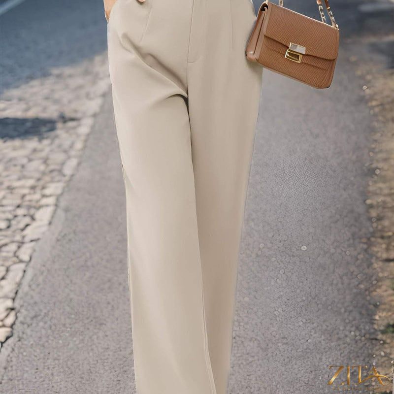 Elegant Zita La Belle Elite women's suit pants with pockets, tailored fit, and classic design for professional or formal wear.